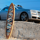 Illustration for article titled Someone Actually Commissioned a Surfboard With a 24-Karat Gold Trim to Pair With Their Rolls-Royce